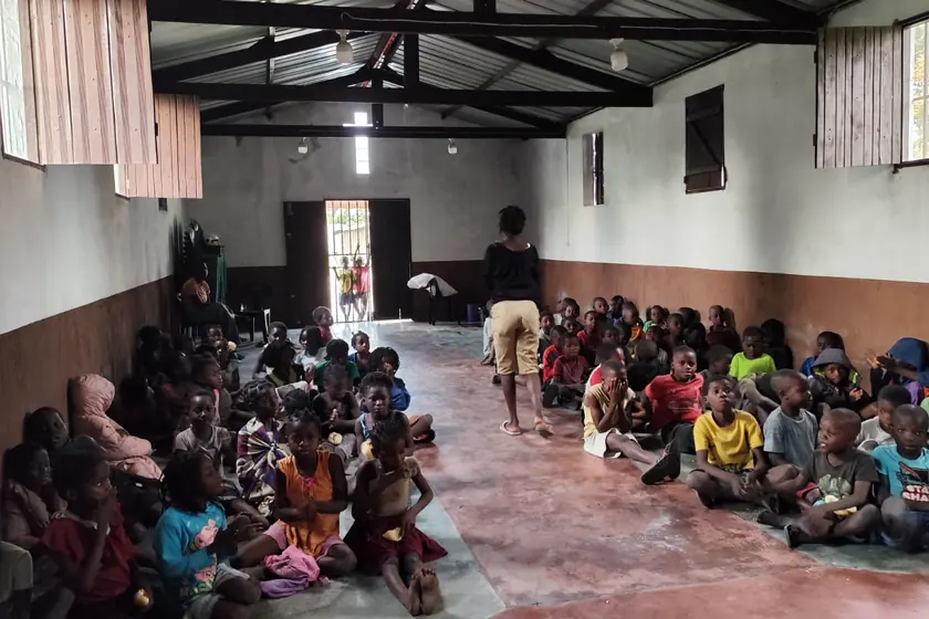 Community assembly gathered at the mission in Mutua
