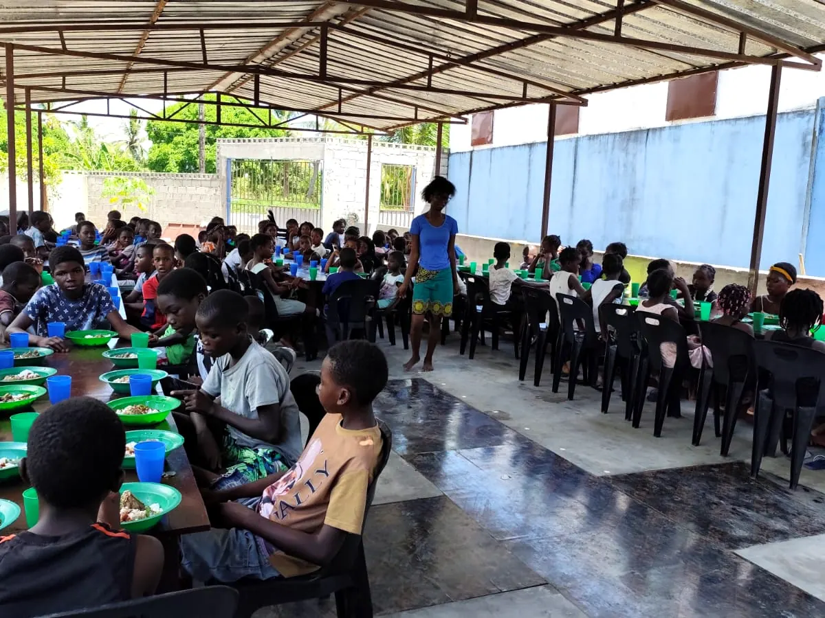 Children sharing a meal at the mission in Mutua, Mozambique