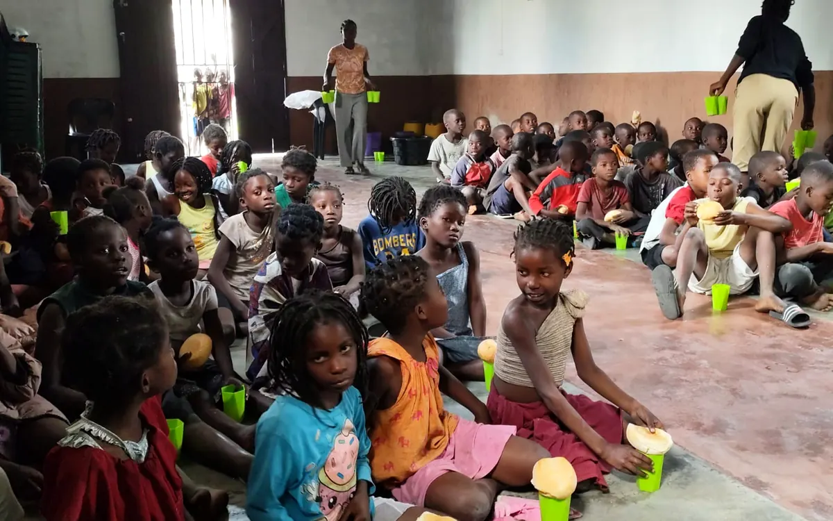 Children sharing a meal at the mission in Mutua, Mozambique
